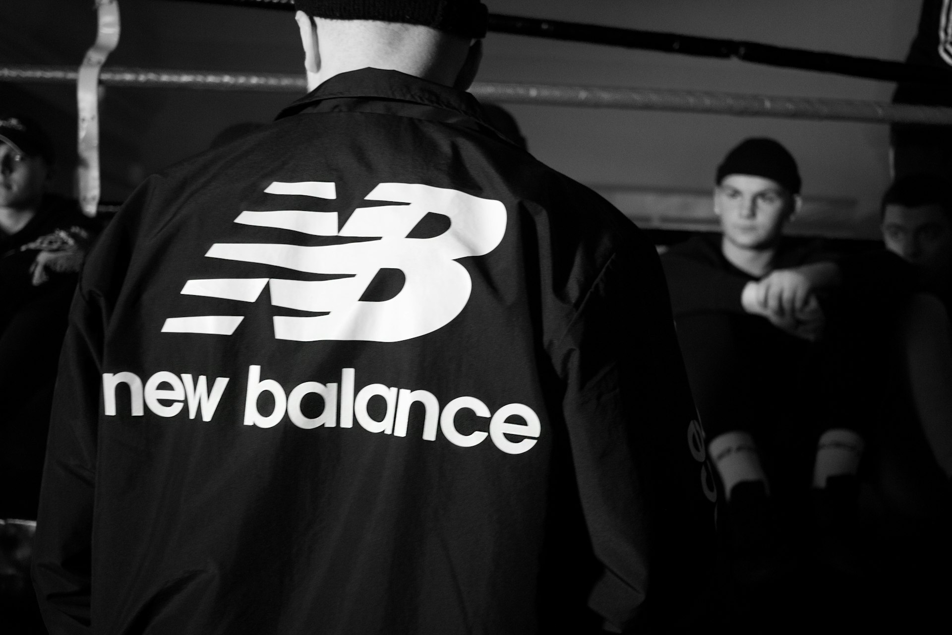 man in black and white adidas jacket